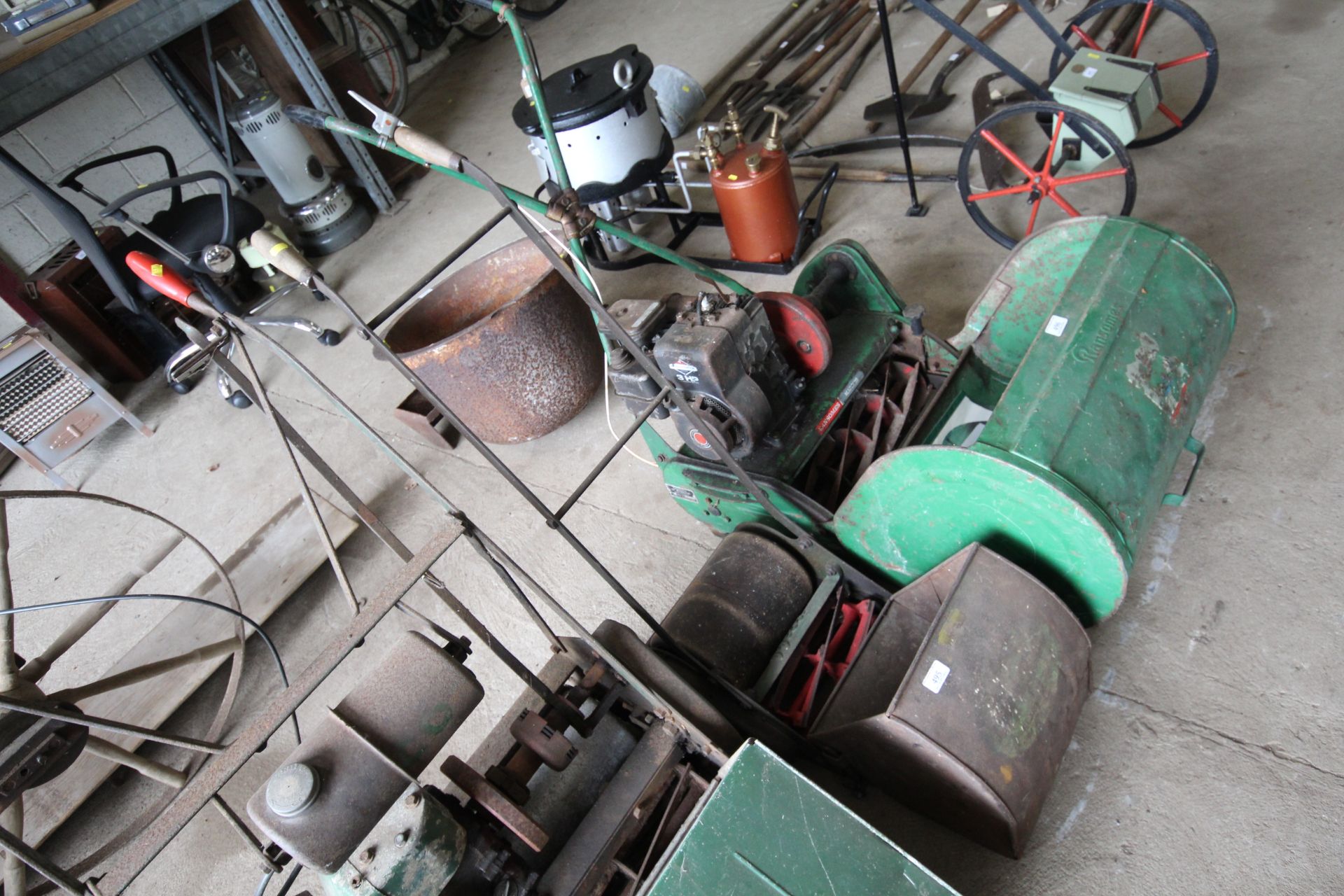 A Webb Whippet hand push mower complete with grass