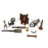 A collection of antique wool winding tools, includ