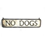 A cast metal sign "No Dogs"