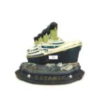 A cast iron door stop in the form of the Titanic