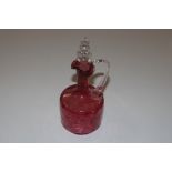 A Victorian cranberry glass decanter