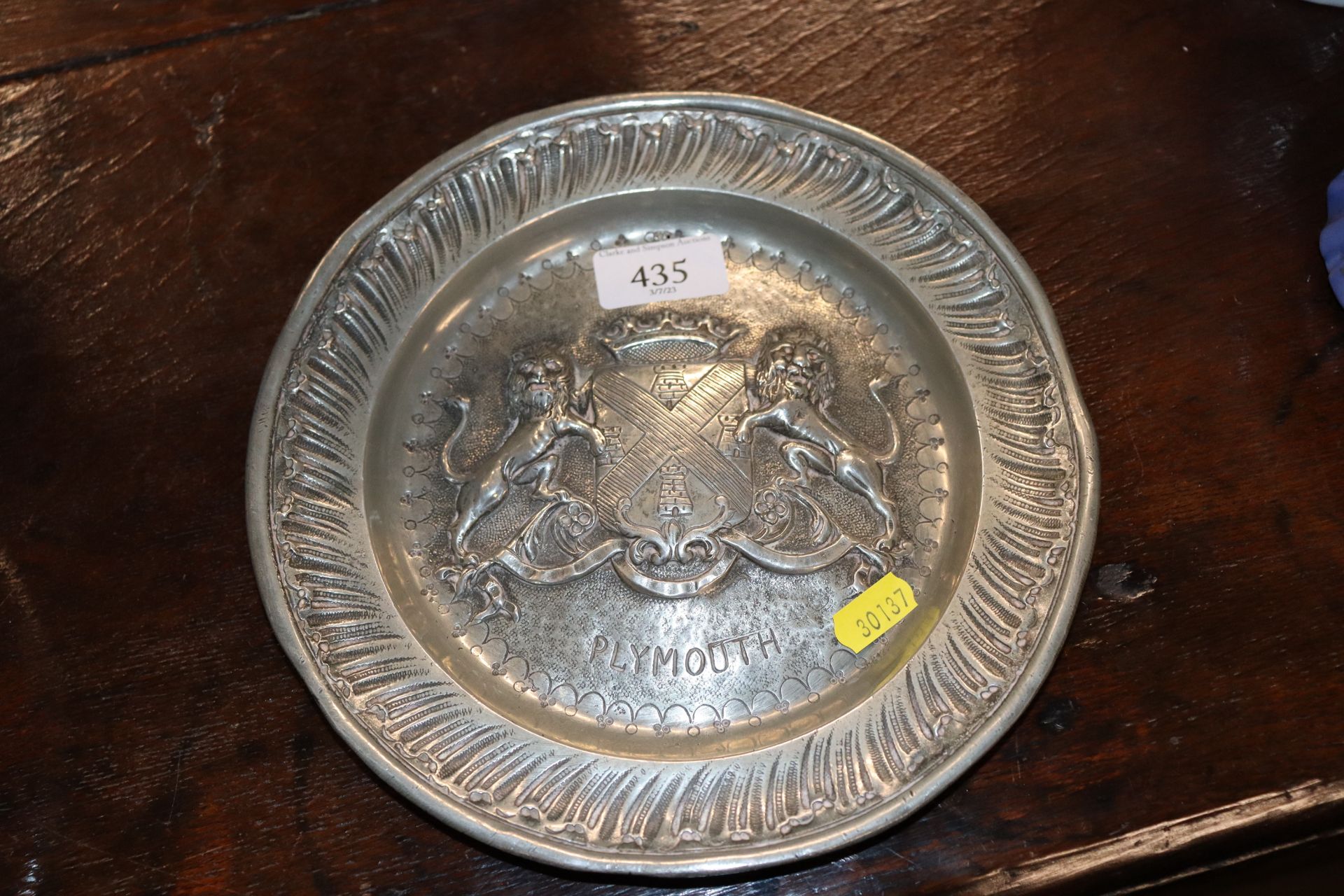 A pewter plate decorated The Arms of Plymouth