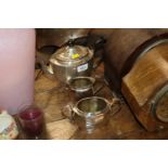 A three piece plated tea set