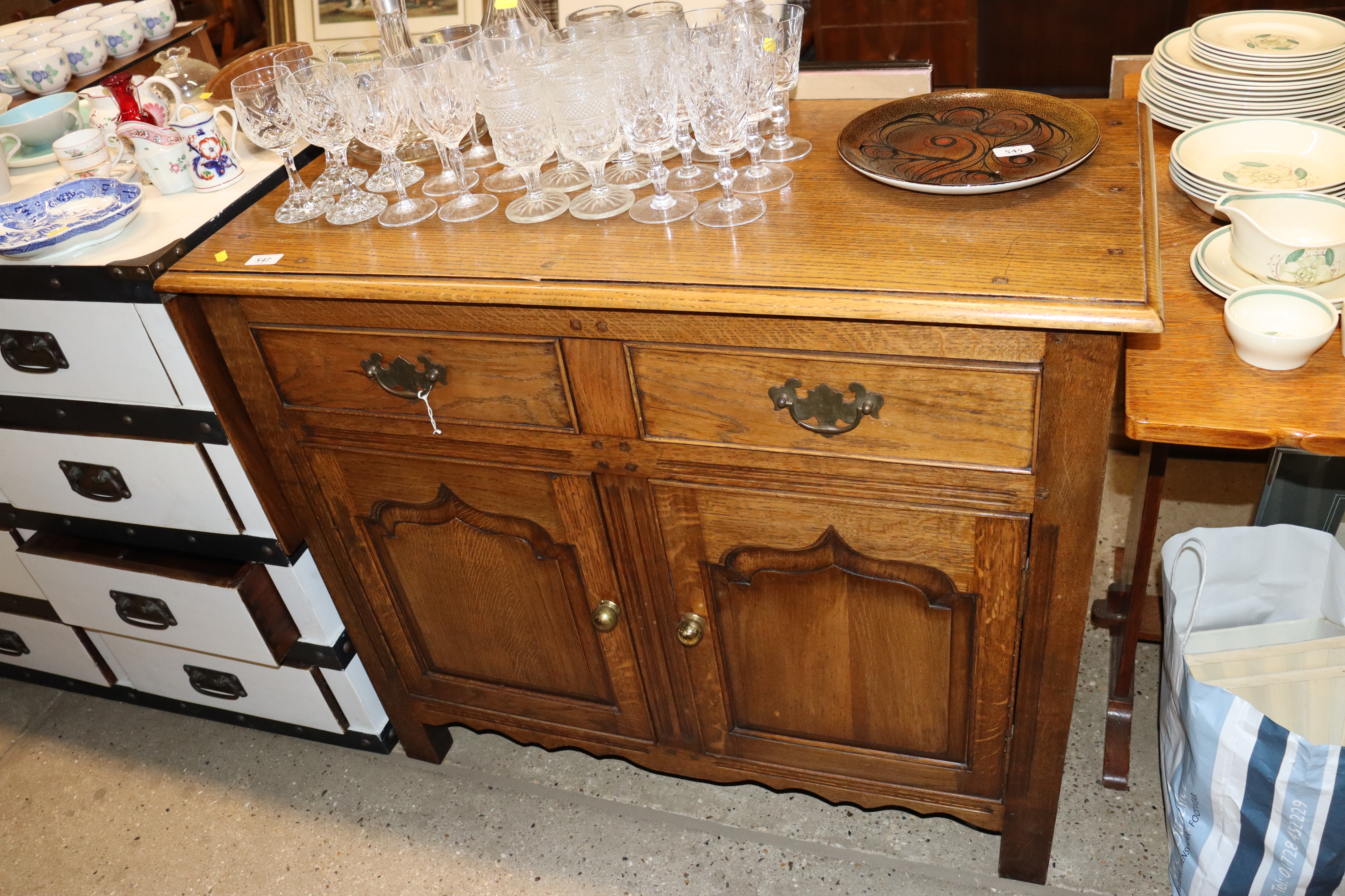 An oak sideboard with drop flap