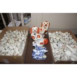 A pair of blue and white china reclining hounds an