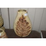 A Bernard Rooke leaf decorated vase