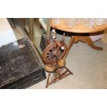 An antique elm and bone mounted spinning wheel