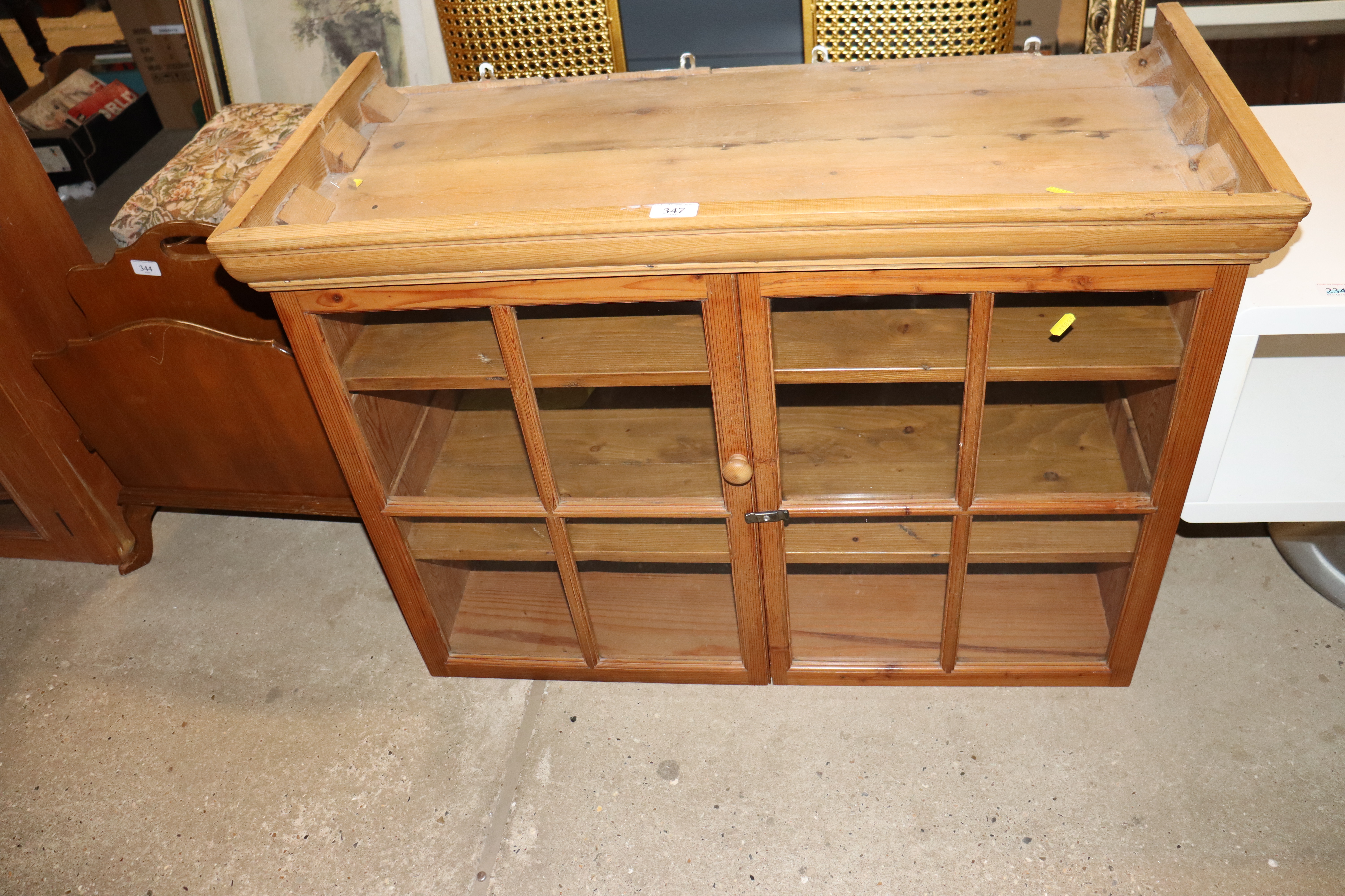 A stripped pine wall mounting display cabinet