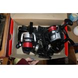 Two Storm fishing reels and one other