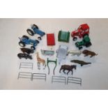 A quantity of various toy farm vehicles and animal