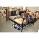 A metal and brass double bedframe