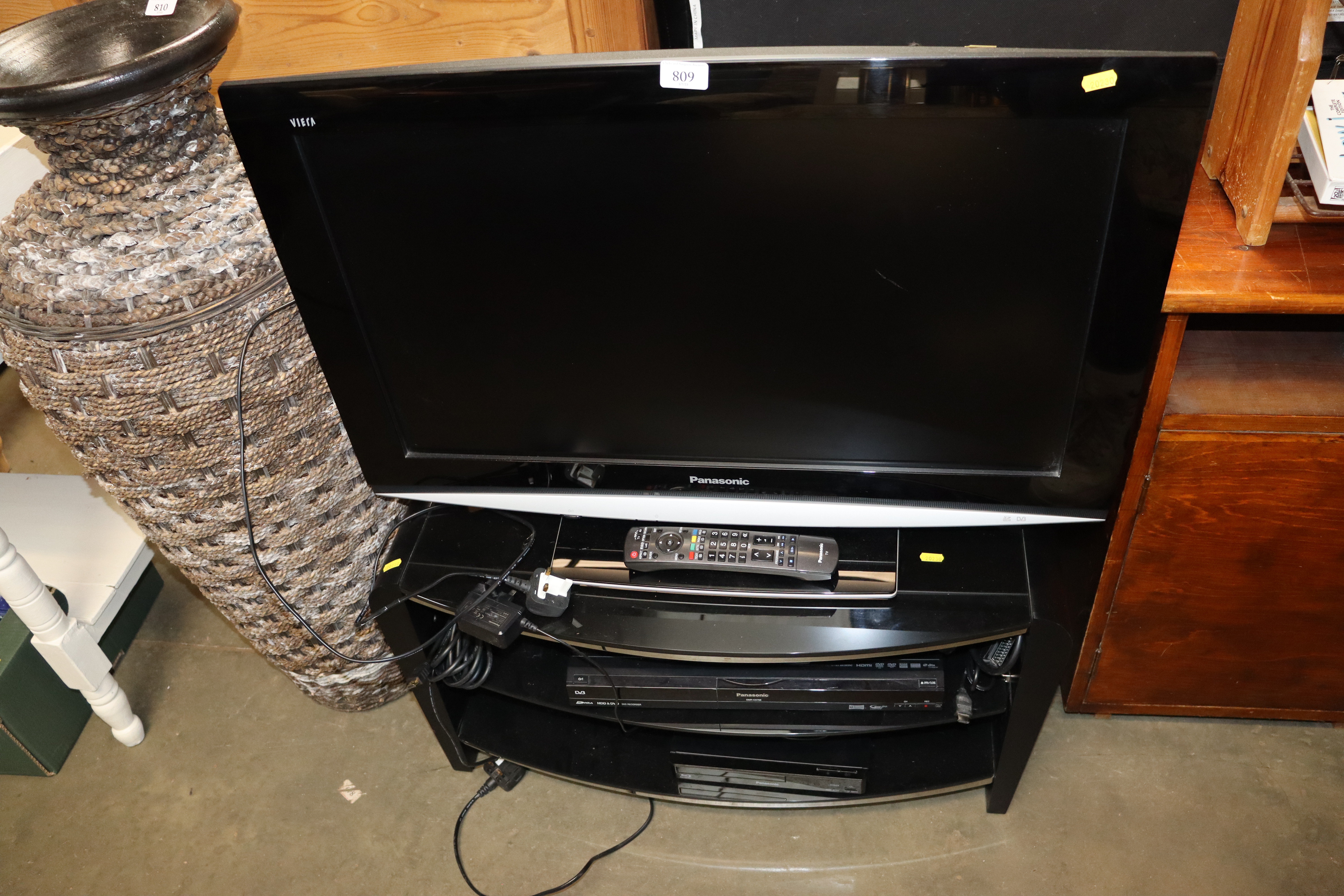 A Panasonic flat screen television with remote con