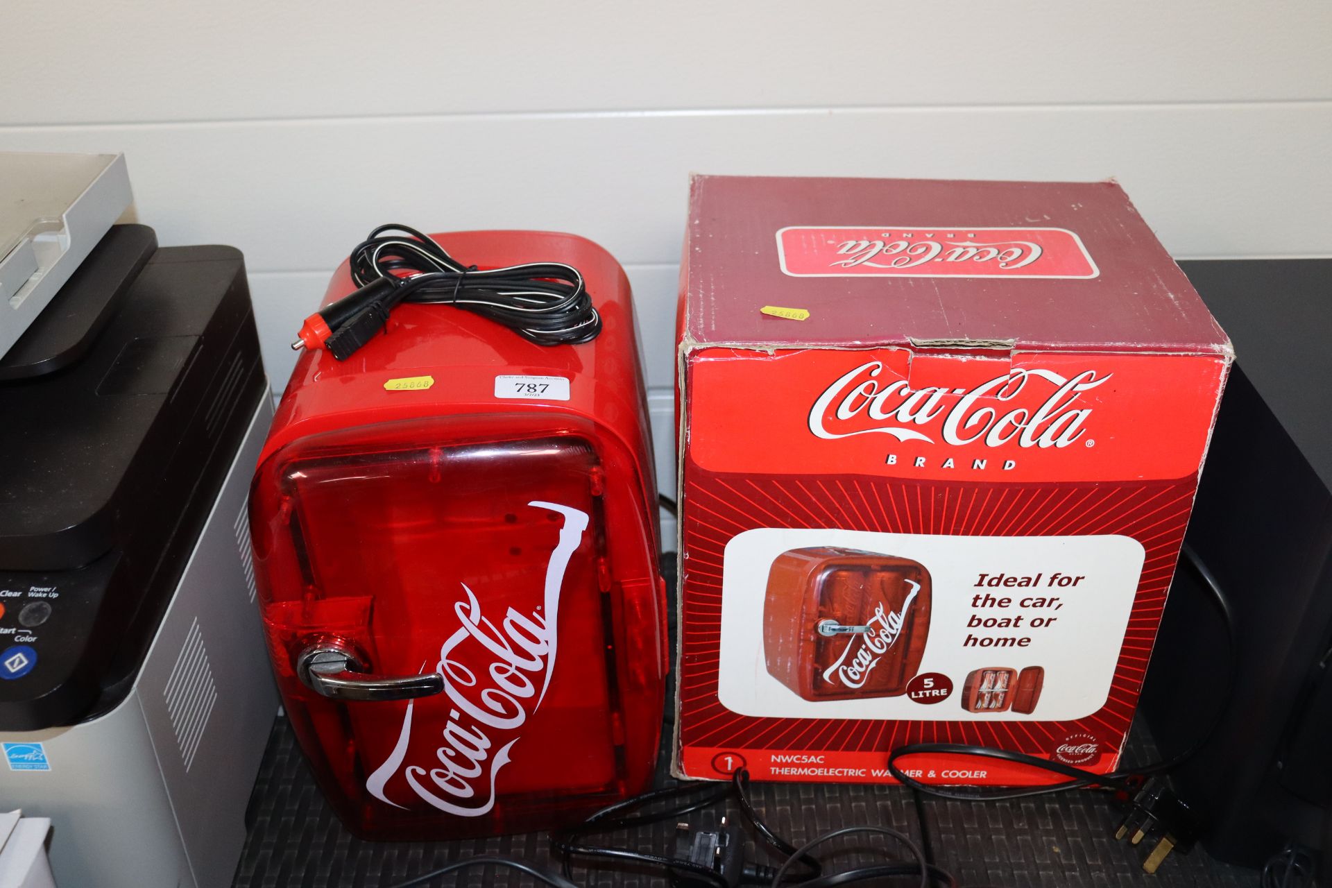 A Coca-Cola mini fridge with original box