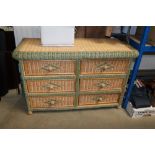 A wooden and wicker chest fitted six drawers