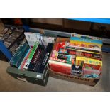 Two boxes of various games and puzzles