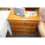 A modern pine chest fitted three drawers