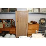 A limed oak single door cupboard