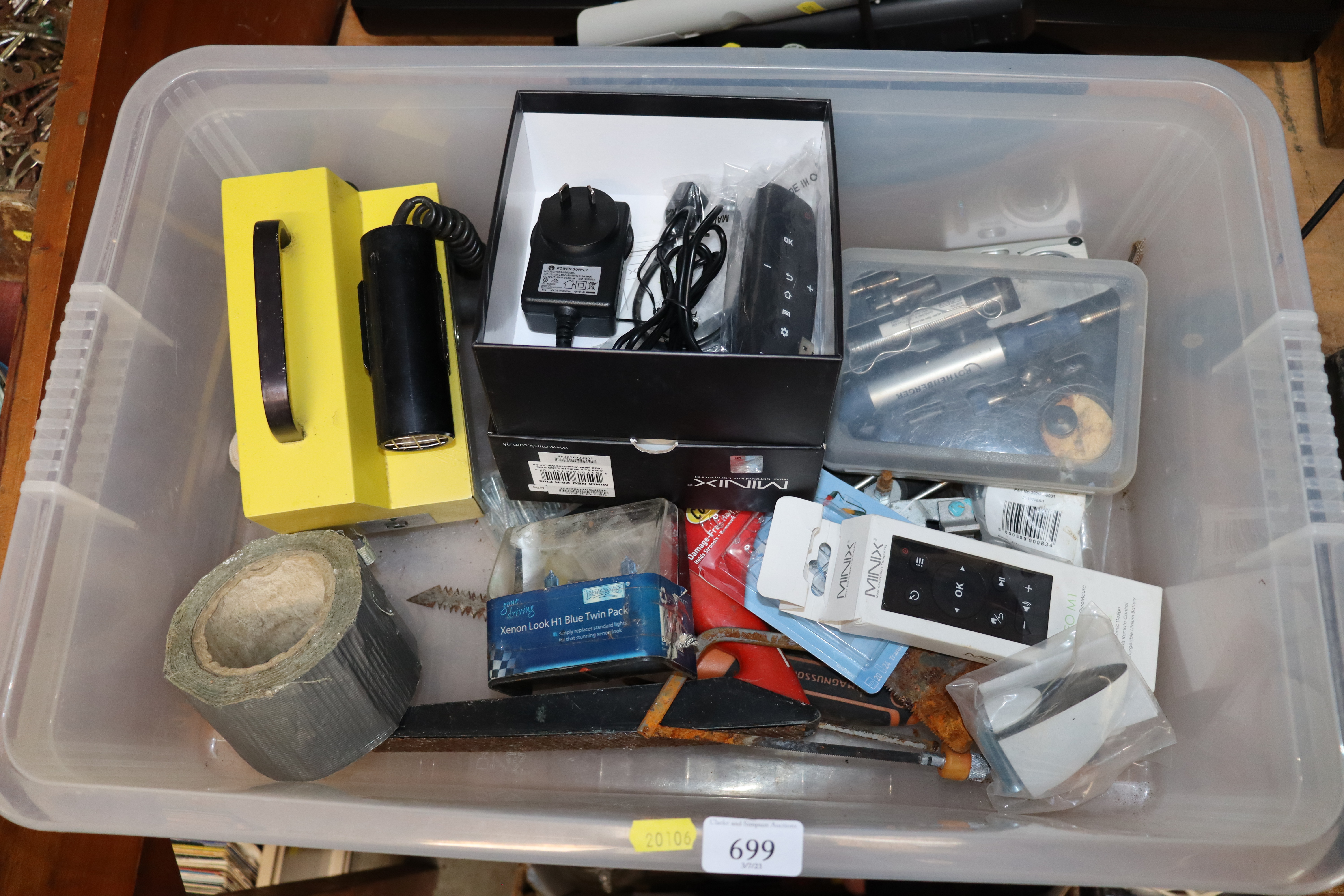 A box of various sundry tools, cameras, etc.