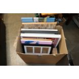 A box of various pictures and prints