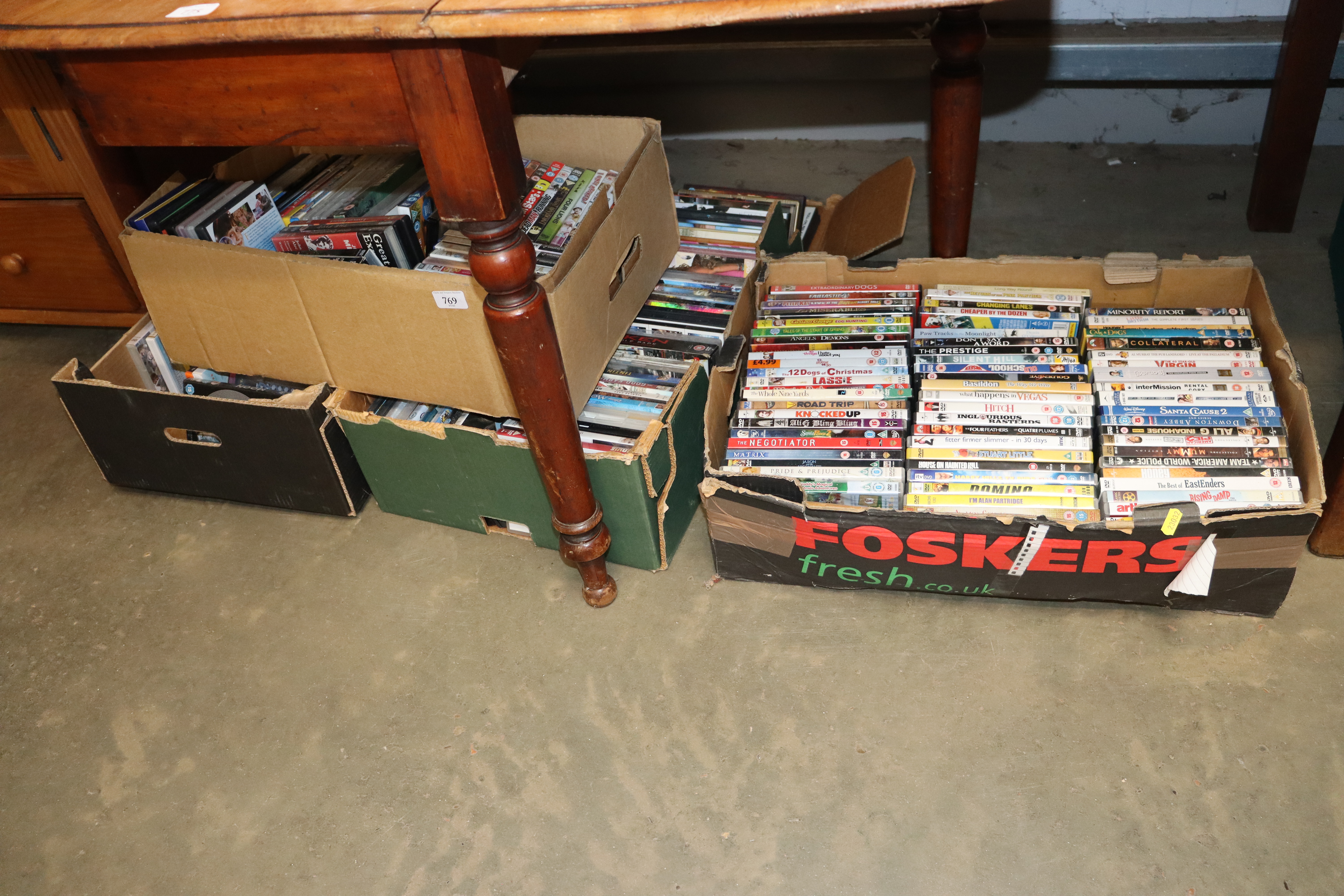 Four boxes of various DVDs