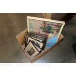 A box of various pictures and prints