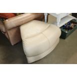 A cream leather pouffe