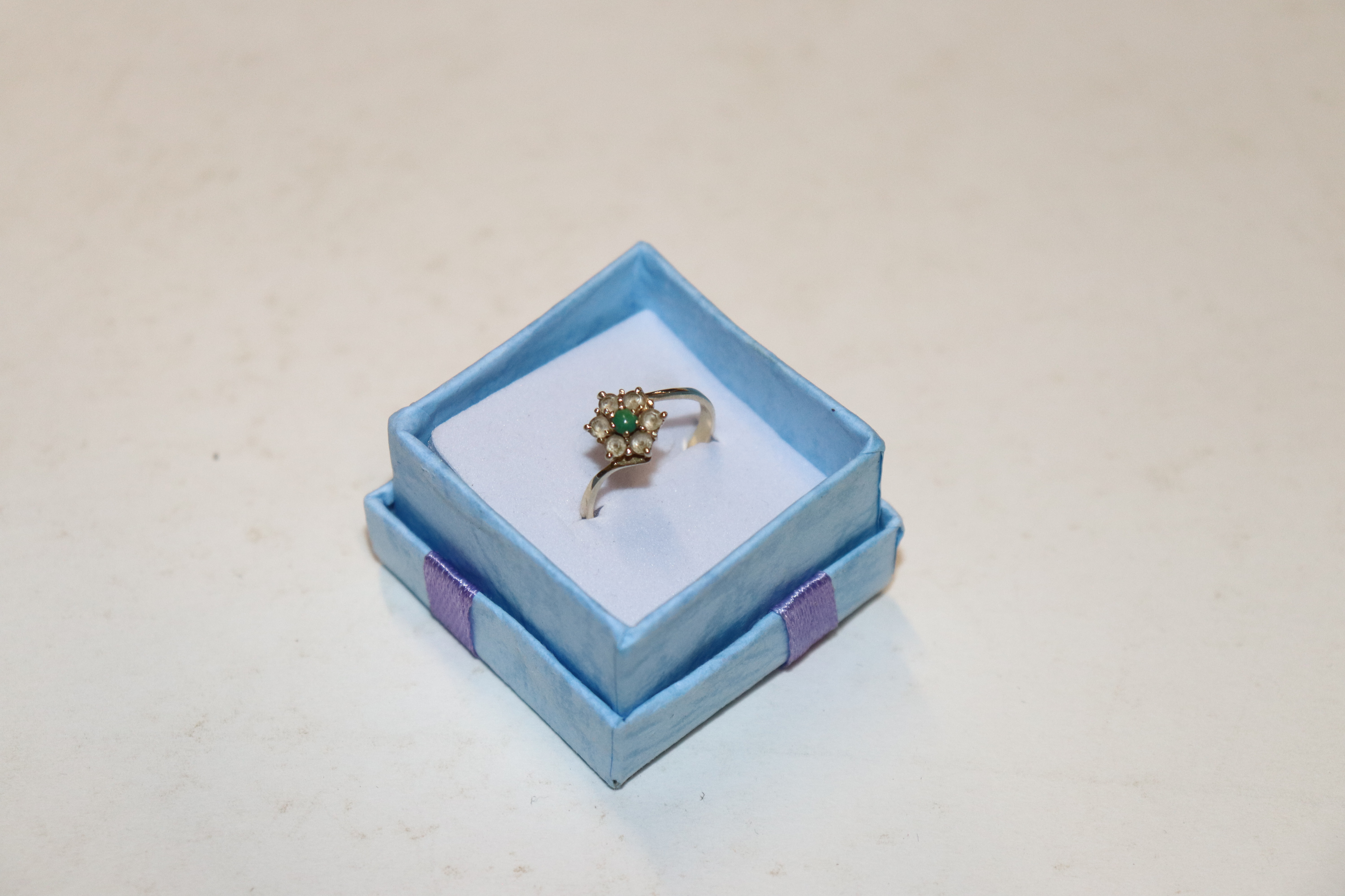 A 14ct gold ring set with turquoise and cubic zirc
