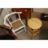 A white pained corner chair and a kitchen stool