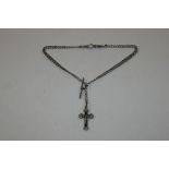 A silver watch chain with crucifix pendant, total