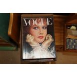 A box of Vogue magazines