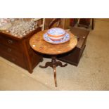 An antique oak snap top occasional table on tripod