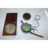 A late Victorian wooden cased compass; and a leath