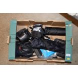 A box of miscellaneous cameras and accessories