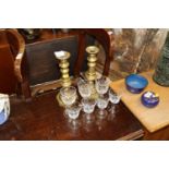 A pair of brass column candlesticks and various gl