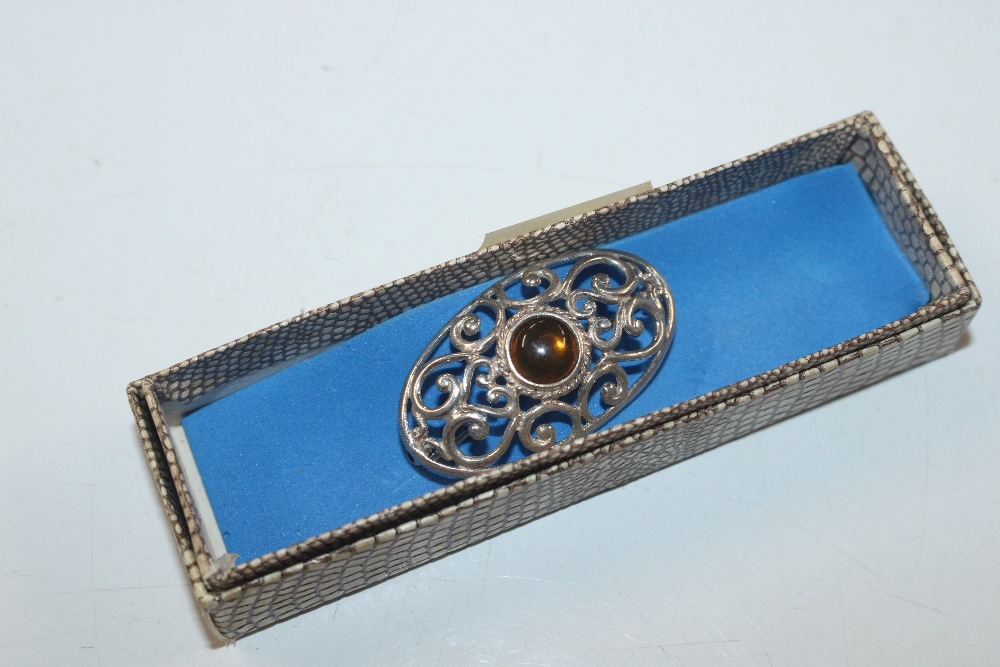 A Sterling silver and amber set brooch