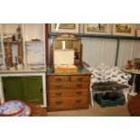 An early 20th Century light oak dressing chest wit