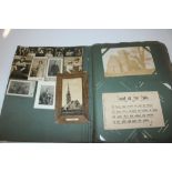 A vintage post-cards album and contents