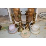 Two pairs of brass candle sticks, two others and a