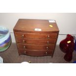 A miniature mahogany bow fronted jewellery chest o