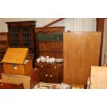 A dark stained pine dresser