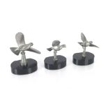 A set of three French plated bird ornaments raised