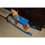 A painted wooden rocking horse