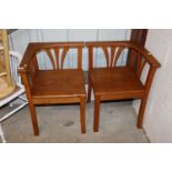 A pair of elm corner chairs
