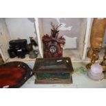 A Black Forest type cuckoo clock and a vintage adv