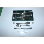 A collection of Sterling silver spoons, thimbles e