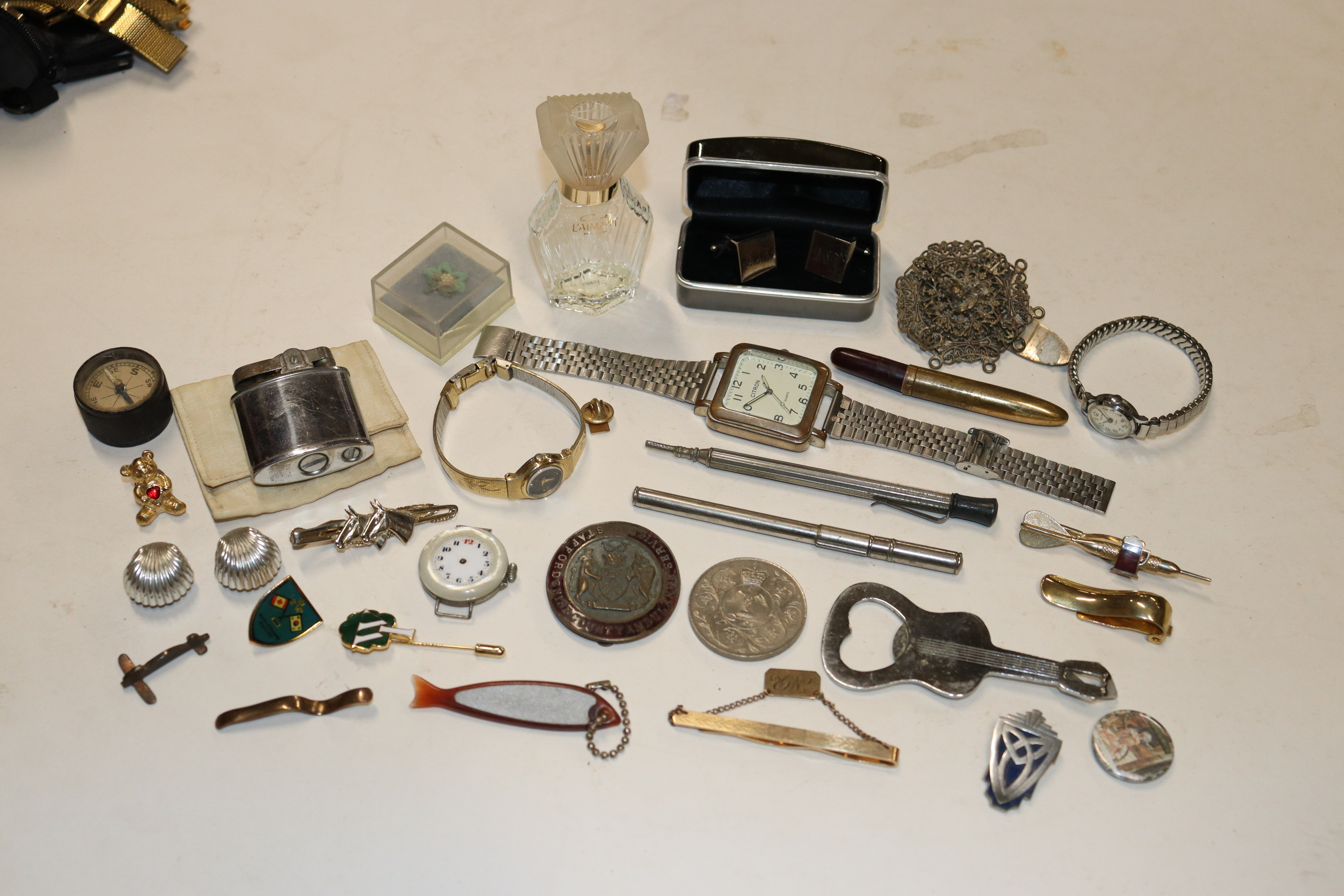 A tray of various watches and other costume jewell