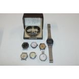 A box containing various vintage wrist watches etc