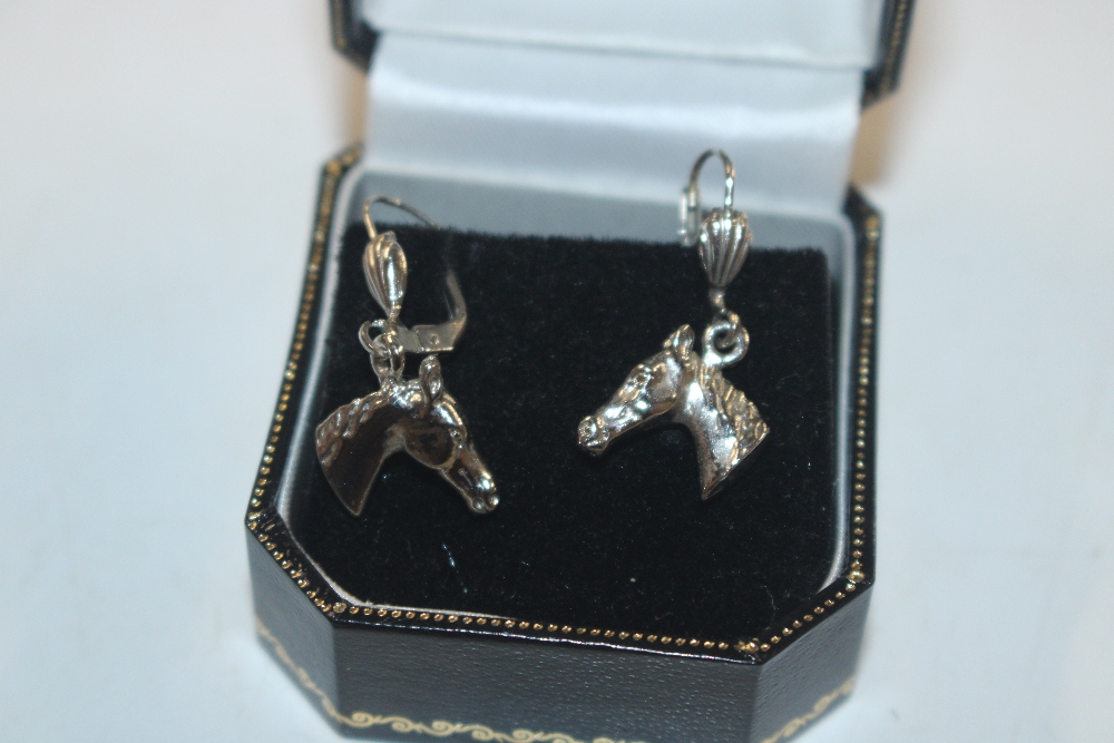 A pair of horse decorated ear-rings, marked West G