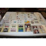 A box of First Day covers, stamp album, post-cards