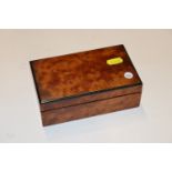 An Art Deco style Amboyna wood cigarette box